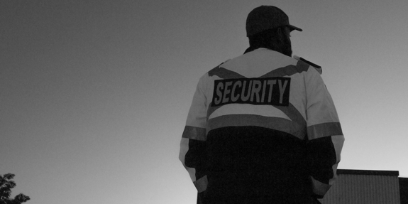 BLACK AND WHITE SECURITY GUARD 