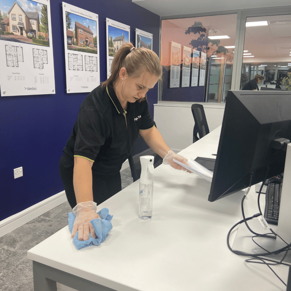 Female cleaning office 